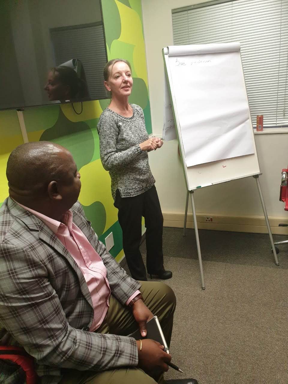 A B2B Ambassadors facilitator leading a session at a flip chart