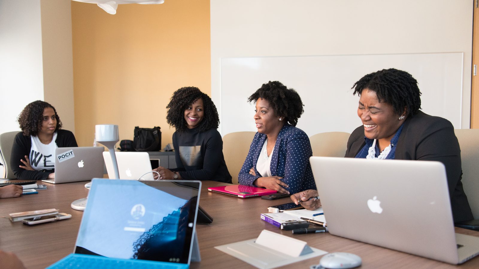 A B2B team collaborating around a table during a working session